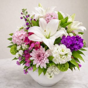 A unique vase featuring a mix of beautifully arranged flowers